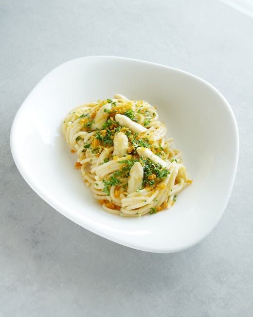 Tantalizing Italian pasta garnished with herbs and breadcrumbs, showcasing Sardinian cuisine.